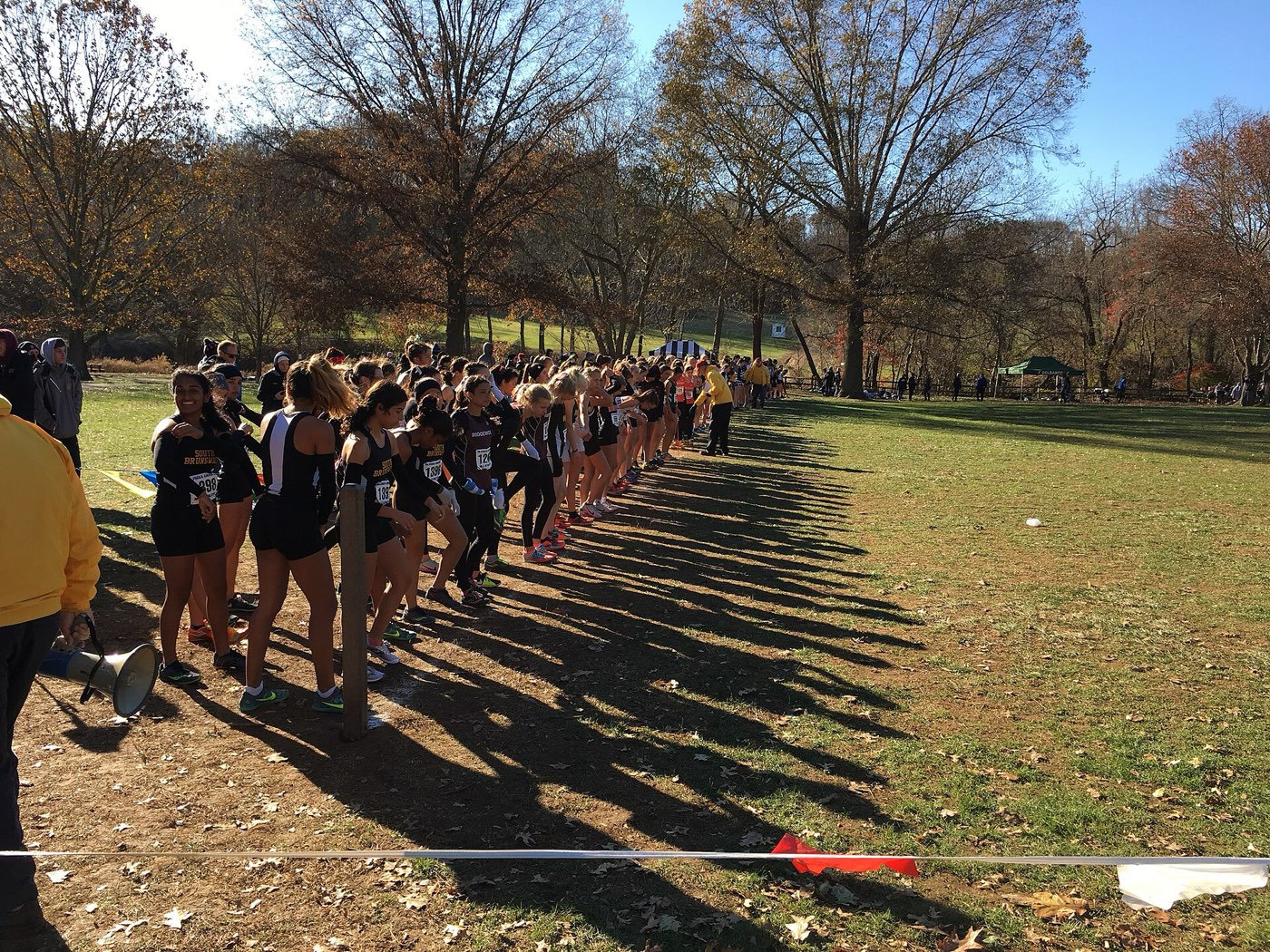 Young runners mid-race on a cross-country course