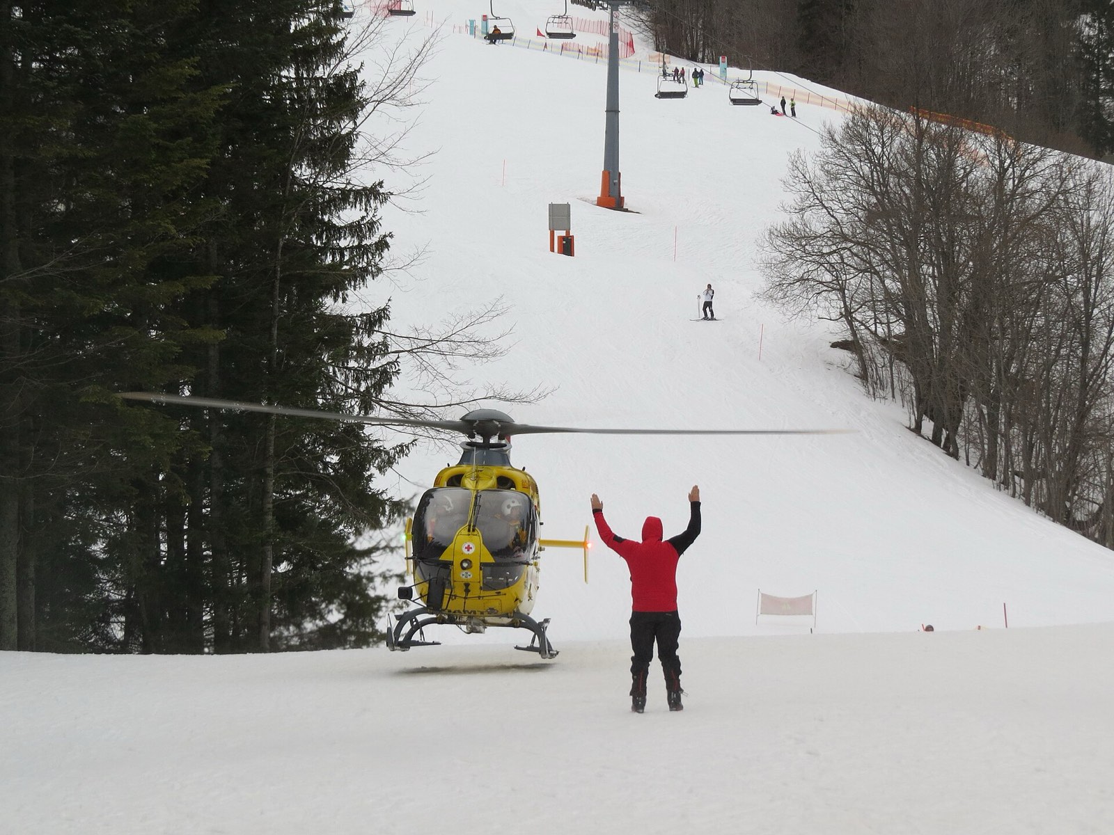A rescue helicopter on a snowy slope